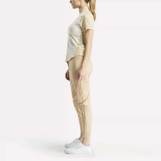 Haut à manches courtes et fermeture éclair 1/4 avec imprimé mini argyle pour femme