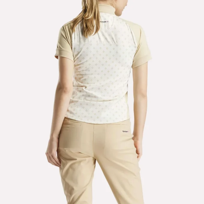 Haut à manches courtes et fermeture éclair 1/4 avec imprimé mini argyle pour femme