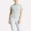 Polo de golf moulant à manches courtes et fermeture éclair pour femme Polo de golf moulant à manches courtes et fermeture éclair pour femme