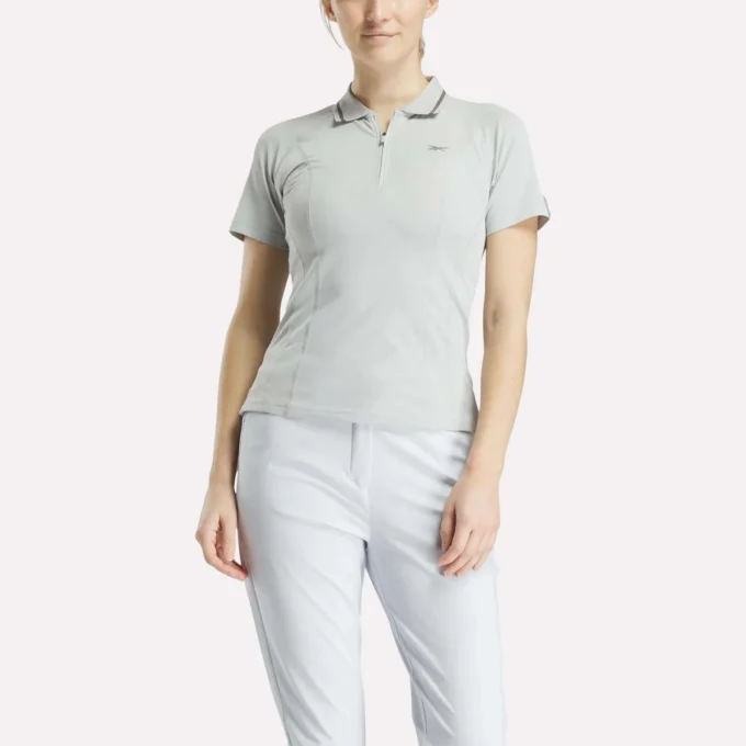 Polo de golf moulant à manches courtes et fermeture éclair pour femme Polo de golf moulant à manches courtes et fermeture éclair pour femme