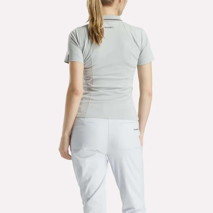 Polo de golf moulant à manches courtes et fermeture éclair pour femme Polo de golf moulant à manches courtes et fermeture éclair pour femme