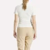 Polo de golf moulant à manches courtes et fermeture éclair pour femme