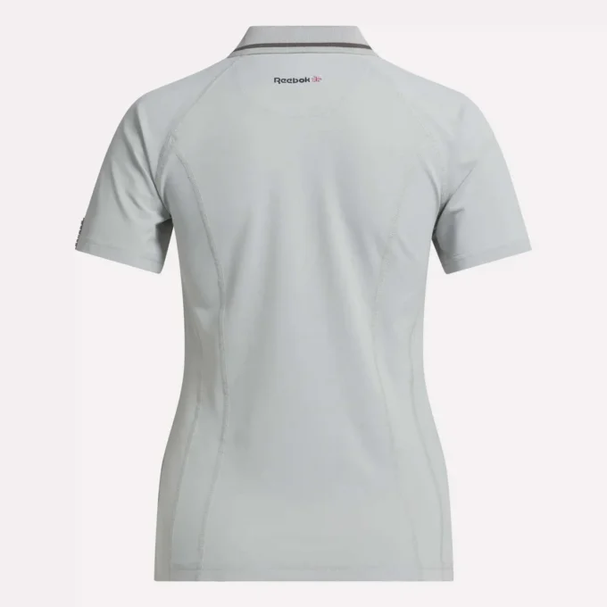 Polo de golf moulant à manches courtes et fermeture éclair pour femme Polo de golf moulant à manches courtes et fermeture éclair pour femme