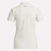 Polo de golf moulant à manches courtes et fermeture éclair pour femme