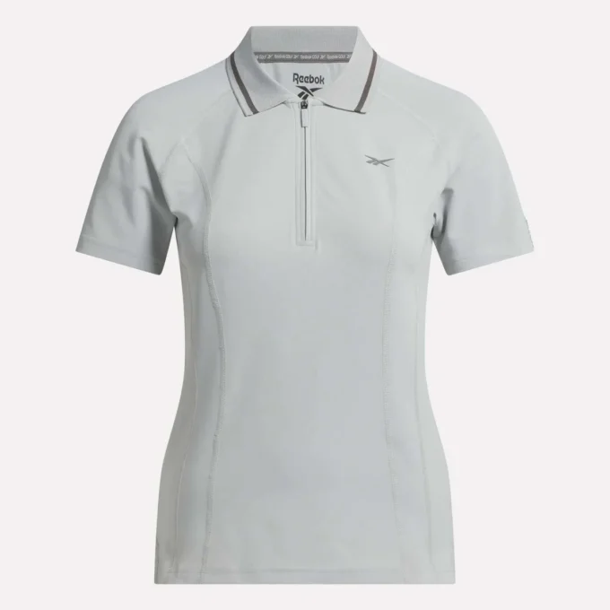 Polo de golf moulant à manches courtes et fermeture éclair pour femme Polo de golf moulant à manches courtes et fermeture éclair pour femme