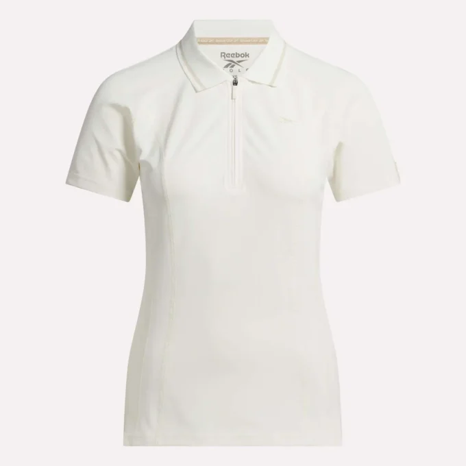 Polo de golf moulant à manches courtes et fermeture éclair pour femme