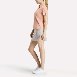 Polo à manches courtes et patte de boutonnage en piqué extensible pour femme