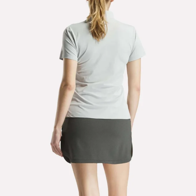 Polo à manches courtes et patte de boutonnage en piqué extensible pour femme